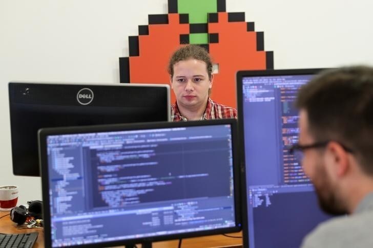 Programmers work on computers in Belgrade, Serbia, July 4, 2018. Picture taken July 4, 2018. REUTERS/Marko Djurica