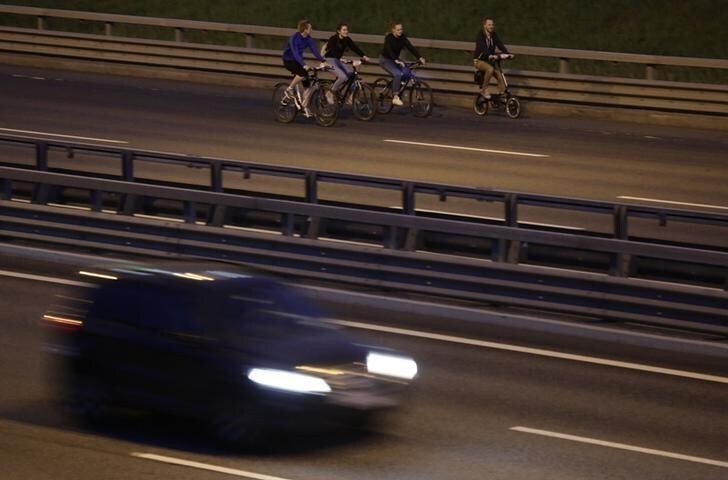 Participants ride their bicycles during a race on the Western High-Speed Diameter (WHSD) highway in St. Petersburg, Russia June 2, 2018. REUTERS/Anton Vaganov