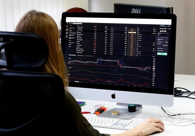 An employee of VP Capital, one of the companies which launched a platform allowing traders to buy shares, gold, foreign exchange and other traditional assets with cryptocurrencies, works at an office in Minsk, Belarus January 15, 2019. REUTERS/Vasily Fedosenko - RC129F63BA80