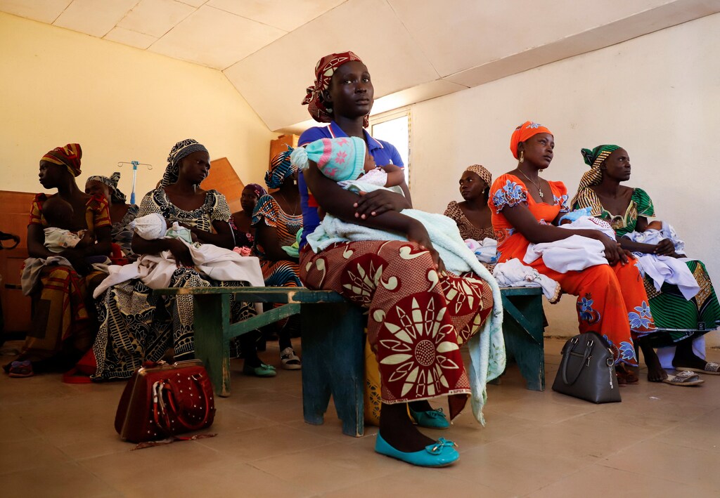 Mothers hold their children as they wait their turn to get them vaccined at the health center in Datcheka, Cameroon January 22, 2024: Gavi and the World Bank are partnering to expand vaccine access