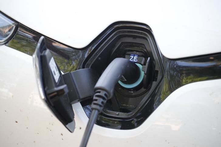 Electric car is charged at the charging station at the front of the German utility E.ON headquarters in Essen, Germany, May 9, 2018. REUTERS/Wolfgang Rattay