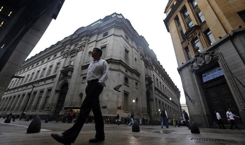 A man walks in Buenos Aires' financial district early August 1, 2014. Argentina's Cabinet chief Jorge Capitanich said on Friday the government held no positive expectations for a court hearing in New York later in the day that will discuss the South American country's debt default. The default occurred after Latin America's No. 3 economy failed to reach a deal with holdout investors suing it for full repayment on bonds they bought at a steep discount following the country's previous default in 2002 on $100 billion of debt. REUTERS/Marcos Brindicci (ARGENTINA - Tags: BUSINESS POLITICS) - GM1EA811PRK01