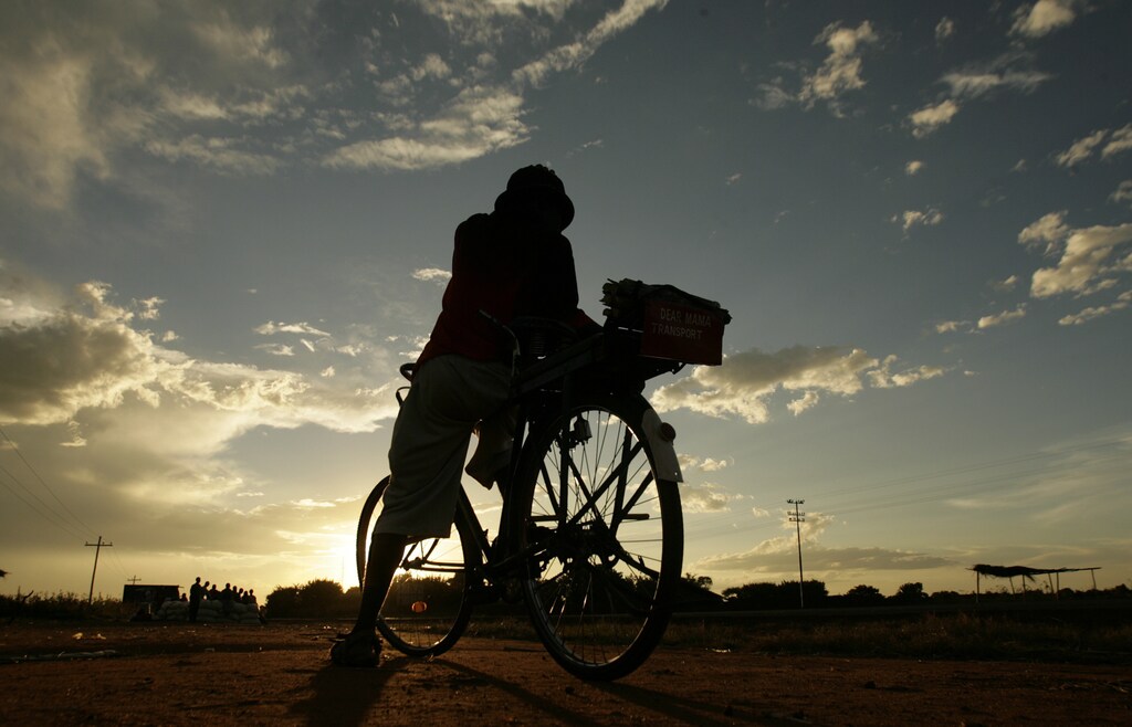 Langiton Sitima waits for customers along the Mchinji road-the highway linking Malawi to Zambia's eastern province, April 21, 2008.