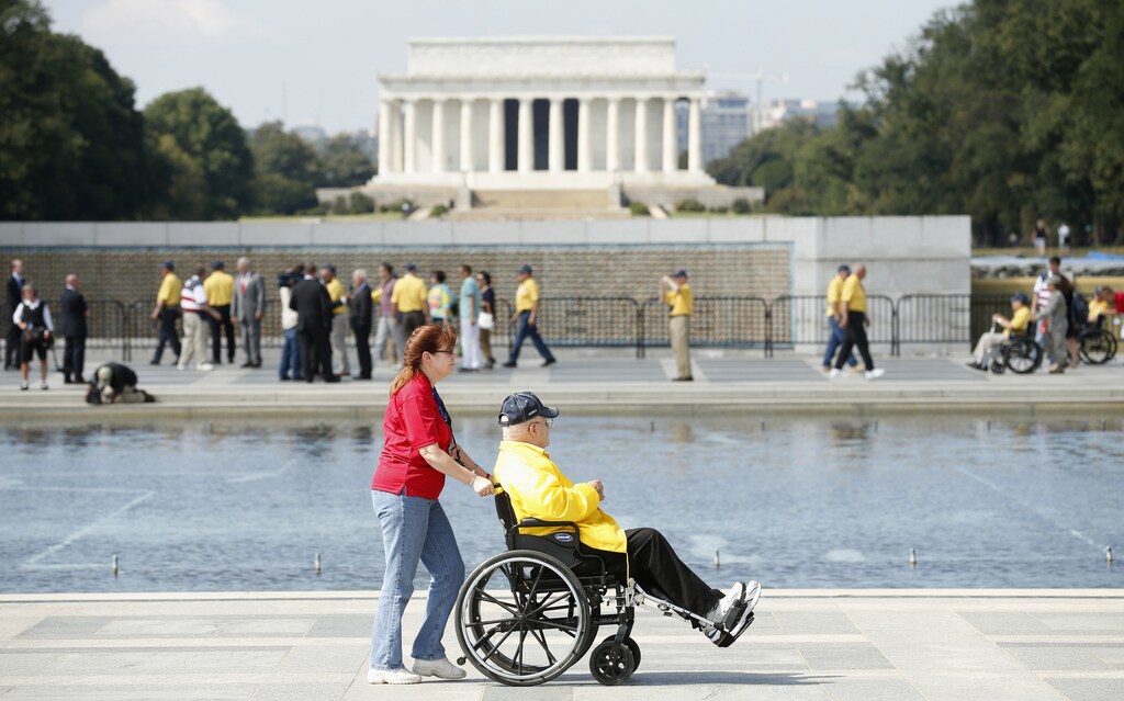 A veteran tours the World War Two Memorial in Washington October 1, 2013. Despite the U.S. government shutdown affecting the site, a barricade was removed to give veterans access to the memorial. Up to one million federal workers were thrown temporarily out of work on Tuesday as the U.S. government partially shut down for the first time in 17 years in a standoff between President Barack Obama and congressional Republicans over healthcare reforms. REUTERS/Kevin Lamarque (UNITED STATES - Tags: POLITICS BUSINESS CONFLICT) - GM1E9A209HS01