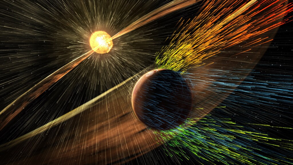 An undated artist's rendering depicts a solar storm hitting Mars and stripping ions from the planet's upper atmosphere in this NASA handout released November 5, 2015.