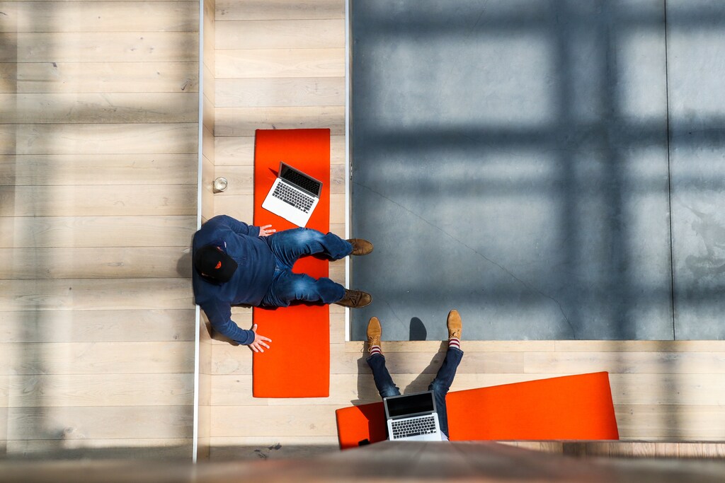 People are seen from above as they work together in the lobby of the Airbnb office headquarters in the SOMA district of San Francisco, California, U.S., August 2, 2016. REUTERS/Gabrielle Lurie - RC1F380A70B0