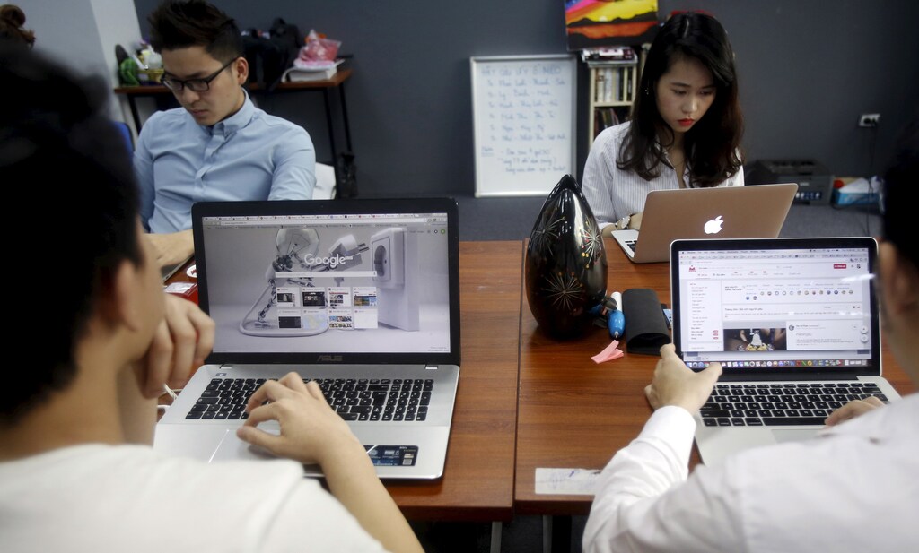People work at the office of food-finder start-up app Lozi in Hanoi, Vietnam, April 7, 2016. Vietnam's tech start-ups are emerging as a force to be reckoned with as foreign private equity funds bet the country's talented young brains will yield more successes.