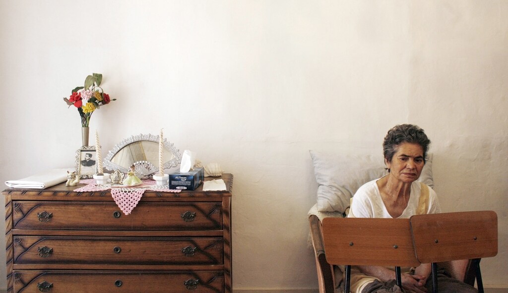 Alzheimer's disease patient Isidora Tomaz, 82, sits in her armchair with two chairs placed in front of her by her husband Amilcar Dos Santos (unseen) to prevent her from falling to the ground in their house in Lisbon September 15, 2009. Several low income Portuguese families with Alzheimer's patients under their care are supported by Portugal's Alzheimer Association, a charity. Alzheimer Europe estimates the number of Alzheimer's patients in the European Union alone to surpass 7.0 million. September 21 is World Alzheimer's Day.