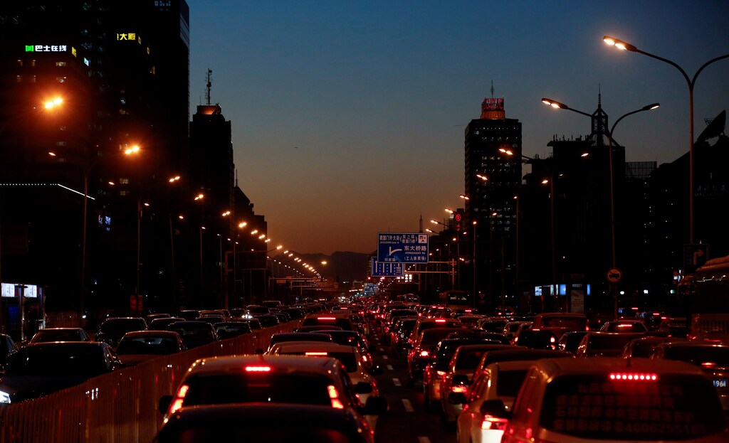 FILE PHOTO: Cars stand bumper to bumper in the evening rush hour traffic jam in central Beijing, China, December 8, 2016. REUTERS/Thomas Peter/File Photo - RTS128B4