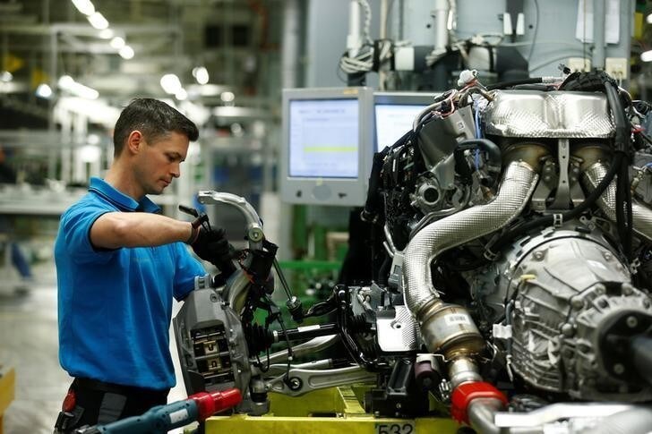 An employee of German car manufacturer Mercedes Benz works on the break chassis of a Mercedes S-Class (S-Klasse) at a production line at the Mercedes Benz factory in Sindelfingen, Germany, January 24, 2018. REUTERS/Ralph Orlowski FOR EDITORIAL USE ONLY