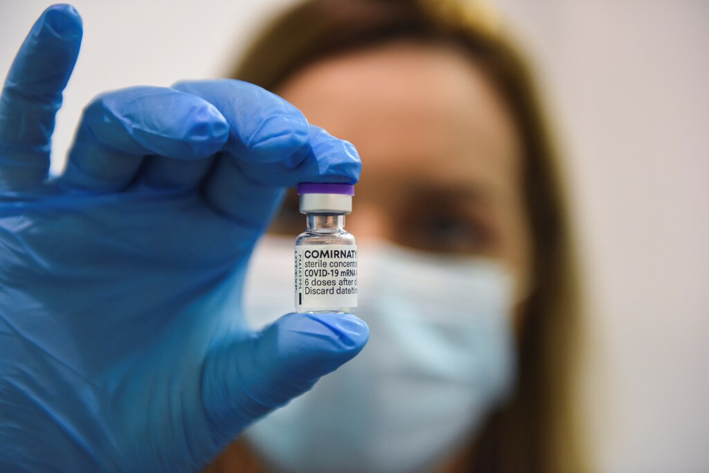 A medical worker holds a vial of the third dose of Pfizer's vaccine against the coronavirus disease (COVID-19) at Belgrade Fair vaccination center in Belgrade, Serbia, August 25, 2021. REUTERS/Zorana Jevtic. - RC29CP9O966J
