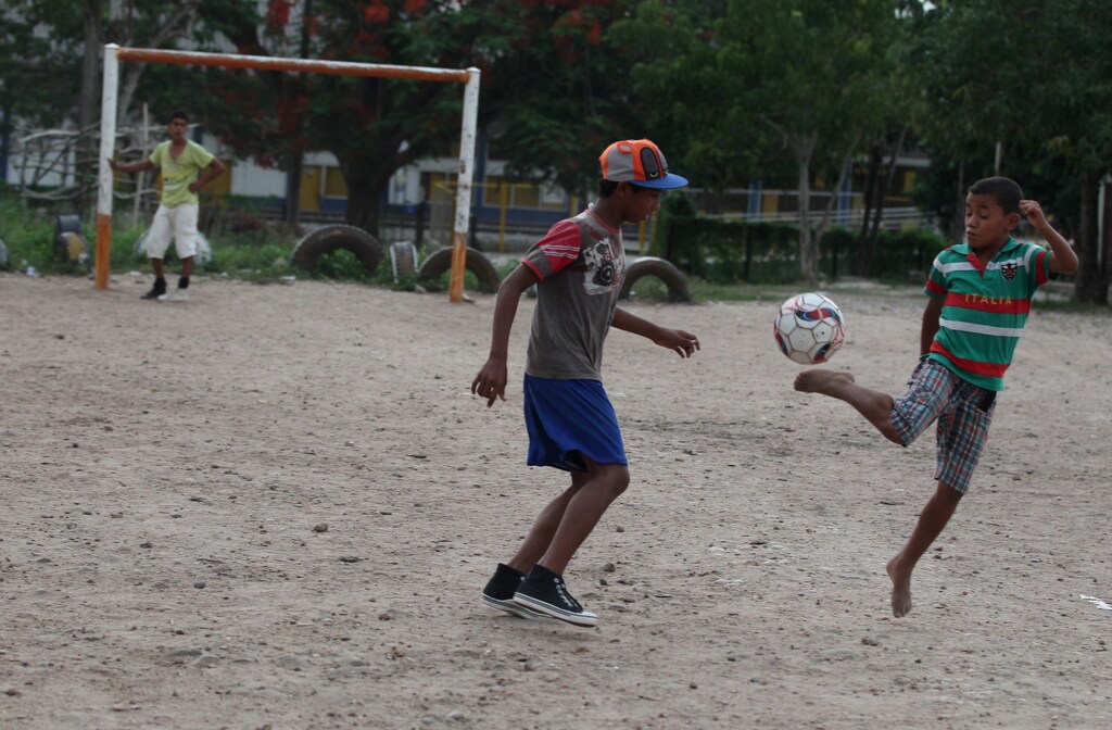 Boys play soccer in Fundacion, northern Colombia May 27, 2014. Picture taken May 27, 2014. REUTERS/John Vizcaino (COLOMBIA - Tags: SPORT SOCCER WORLD CUP) - GM1EA5T043601
