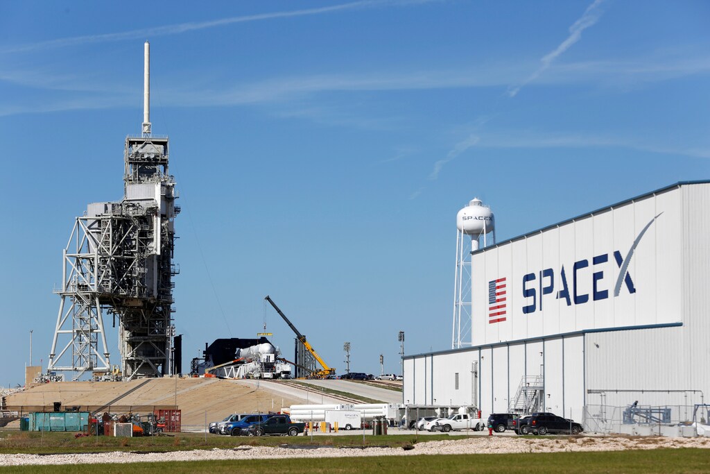 A SpaceX Falcon 9 rocket (in center, in a horizontal position), is readied for launch on a supply mission to the International Space Station on historic launch pad 39A at the Kennedy Space Center in Cape Canaveral, Florida, U.S., February 17, 2017. Launch is scheduled for February 18. REUTERS/Joe Skipper - RTSZ7JV