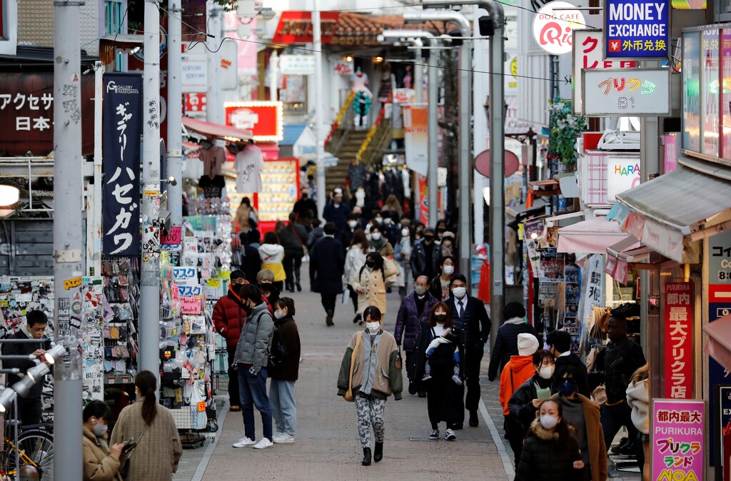Pedestrians wearing protective masks make their way at a shopping district, amid the coronavirus disease (COVID-19) outbreak, in Tokyo, Japan, January 8, 2021. REUTERS/Kim Kyung-Hoon - RC2L3L9GEJWB