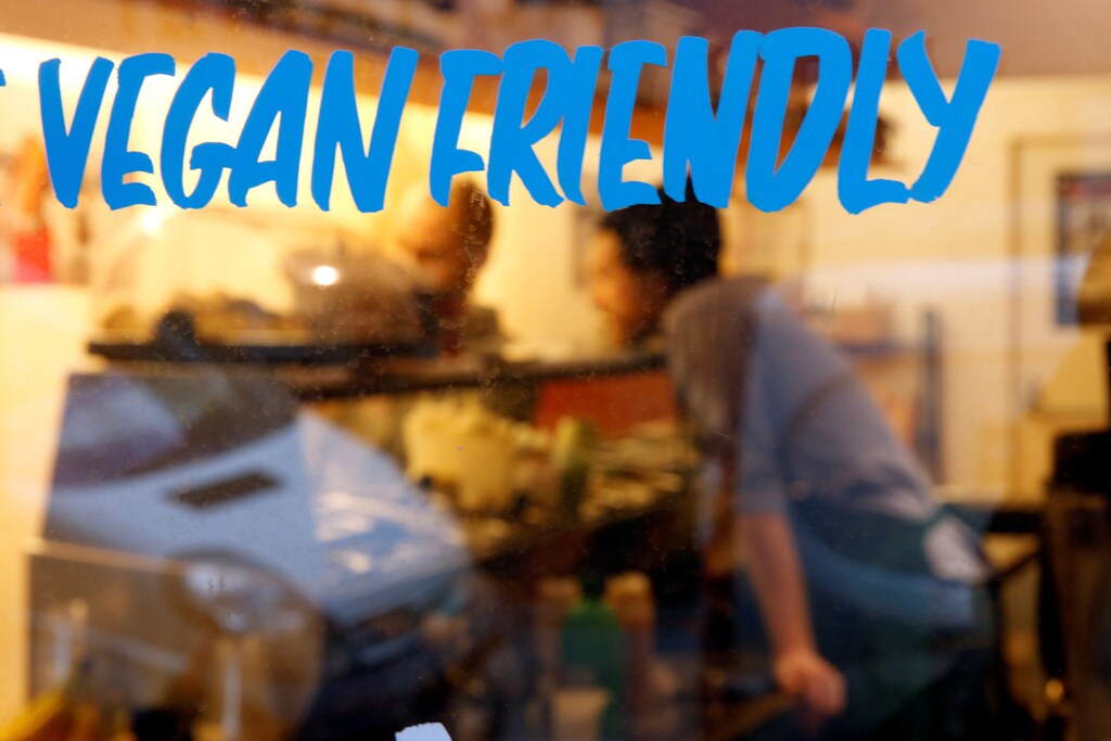 Customers and staff are seen at a vegan restaurant in Paris, January 29, 2018. REUTERS/Philippe Wojazer - RC1DEF506120