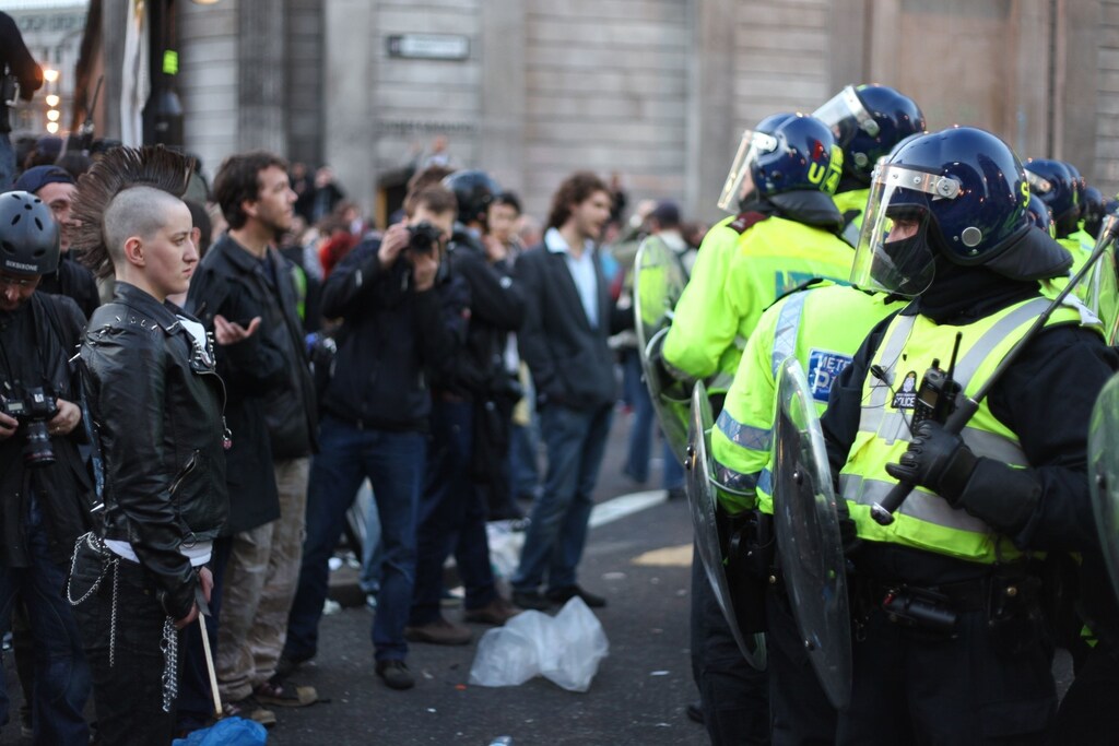 Protestors stand off against police in London, England.