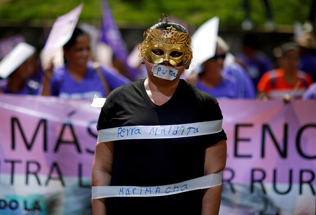 A woman participates in a protest to commemorate the U.N. International Day for the Elimination of Violence Against Women at the Attorney General's Office in San Salvador, El Salvador November 26, 2018. REUTERS/Jose Cabezas TEMPLATE OUT TPX IMAGES OF THE DAY - RC140CDCE100