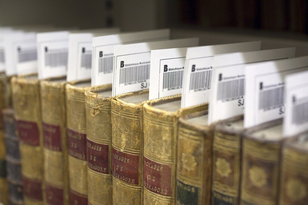 Barcode labels are seen inside rare books ahead of digitisation at the Municipal Library of Lyon in this January 15, 2010 file picture. Amid the flat, wide fields of central France, a team of re-trained secretaries and IT experts is packaging Europe's literary heritage for the digital era. To match feature FRANCE-BOOKS