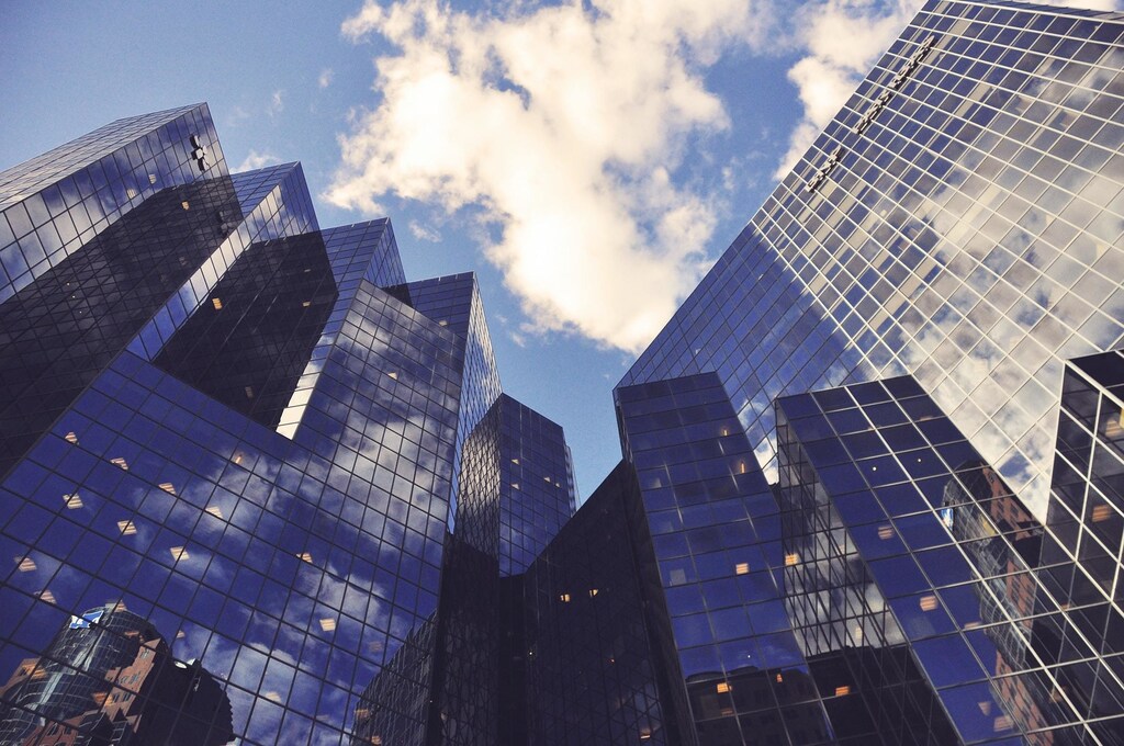 an artistic picture of high rise corporate buildings against the back from of the sky