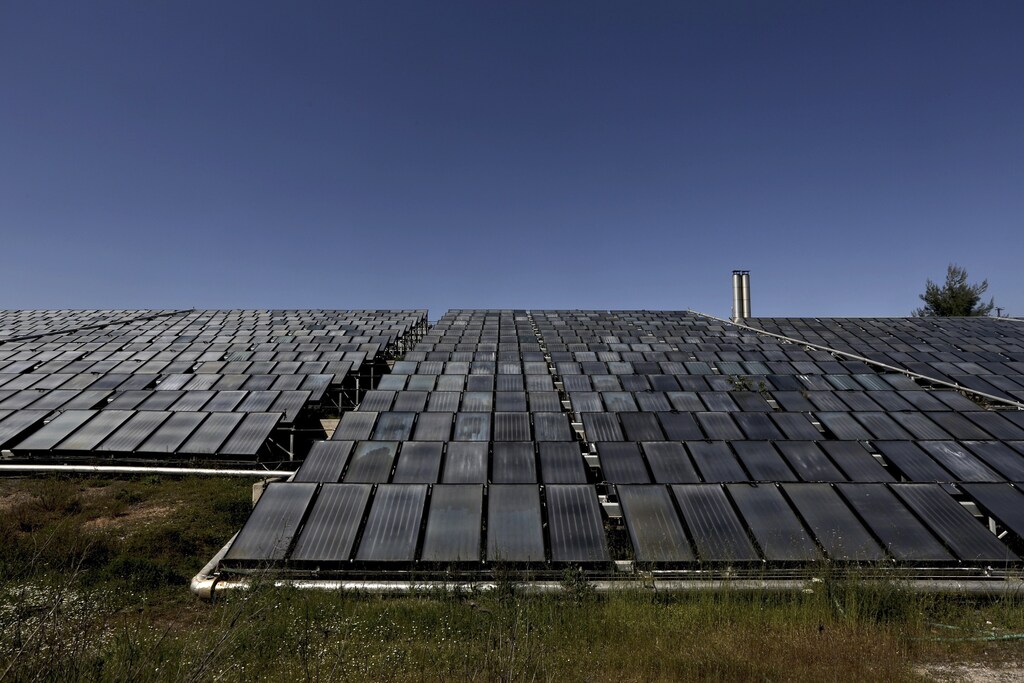 A general view of a giant solar water heating system, which is used at Sarantis industrial company, a company producing and importing frangrances, cosmetics and household products, at Oinofyta area, about 30 miles north of Athens April 11, 2013. Greece has seen a rise in exports of solar water heating systems during the economic crisis, a rare success for the recession-mired Mediterranean country whose economy is heavily dependent on imports. Exports of solar water heating boilers and collectors rose by 4.7 percent and 13.4 percent respectively in 2011-12, according to the Greek Solar Industry Association (EBHE). Demand for solar water heating collectors domestically also rose by +5.6 percent in the same period, pushed higher by a rise in the price of electricity and heating oil, EBHE says. However, domestic demand for solar water heater boilers saw a decline in demand of 2.5 percent. Picture taken April 11, 2013. REUTERS/Yorgos Karahalis (GREECE - Tags: BUSINESS ENERGY INDUSTRIAL) - RTXZ0OE