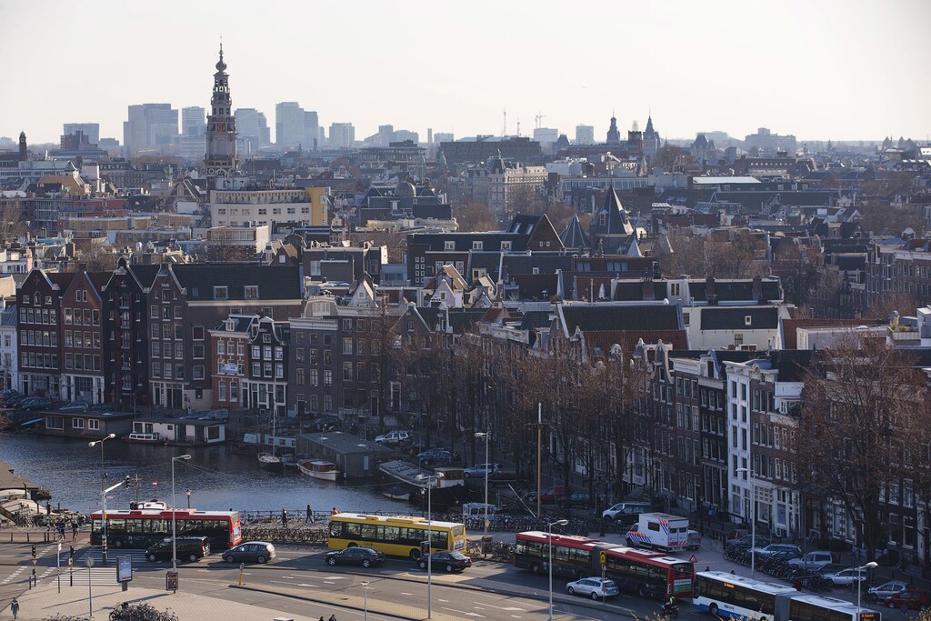 A rootop view of Amsterdam from SkyLounge on the 11th floor of the DoubleTree by Hilton Hotel in Amsterdam April 2, 2013. The Royal celebrations in the Netherlands this week put the country and the capital Amsterdam on front pages and television screens around the world with an orange splash. There's plenty to see and do in 48 hours in this compact city, where the world-famous Rijksmuseum only recently reopened after an extensive renovation. Picture taken April 2, 2013. To match story TRAVEL-AMSTERDAM/ REUTERS/Michael Kooren (NETHERLANDS - Tags: TRAVEL CITYSCAPE) - RTXZ8LG