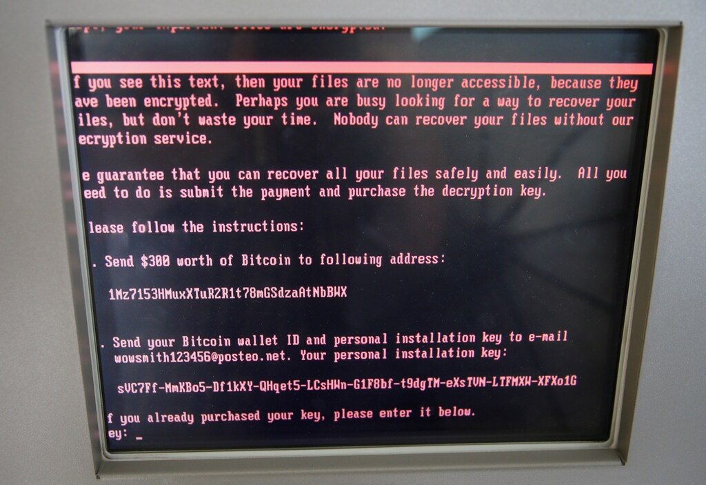A message demanding money is seen on a monitor of a payment terminal at a branch of Ukraine's state-owned bank Oschadbank after Ukrainian institutions were hit by cyber attacks, in Kiev, Ukraine June 27, 2017. Picture taken June 27, 2017. REUTERS/Valentyn Ogirenko - RC13D3414650
