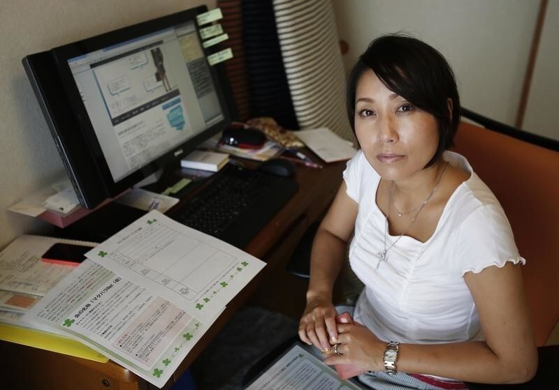 Sayaka Osakabe, founder of "Matahara net," a support group calling for legislation outlining more support for working women, poses for a picture in her house in Kawasaki, south of Tokyo September 11, 2014. When Osakabe, 37, returned to work after a second miscarriage, one of the first questions her boss asked was whether she was having sex again. After winning a settlement through a labour tribunal in June, Osakabe has been speaking up on behalf of pregnant women and young mothers who are harassed at work. Their plight has spawned a new term: "matahara," a shortened form of "maternity harassment". Despite laws guaranteeing equal opportunity and a near parity of sexes attending university, Japanese women have yet to gain an equal footing in the workplace. With an ageing population and low birth rate, lawmakers and economists say Japan must encourage more women to both work and have children