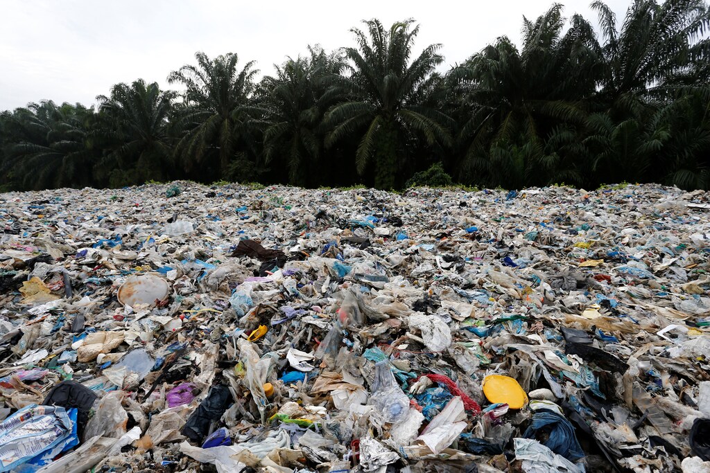 Plastic waste are piled outside an illegal recycling factory in Jenjarom, Kuala Langat, Malaysia October 14, 2018. Picture taken October 14, 2018. REUTERS/Lai Seng Sin - RC1B493C6440