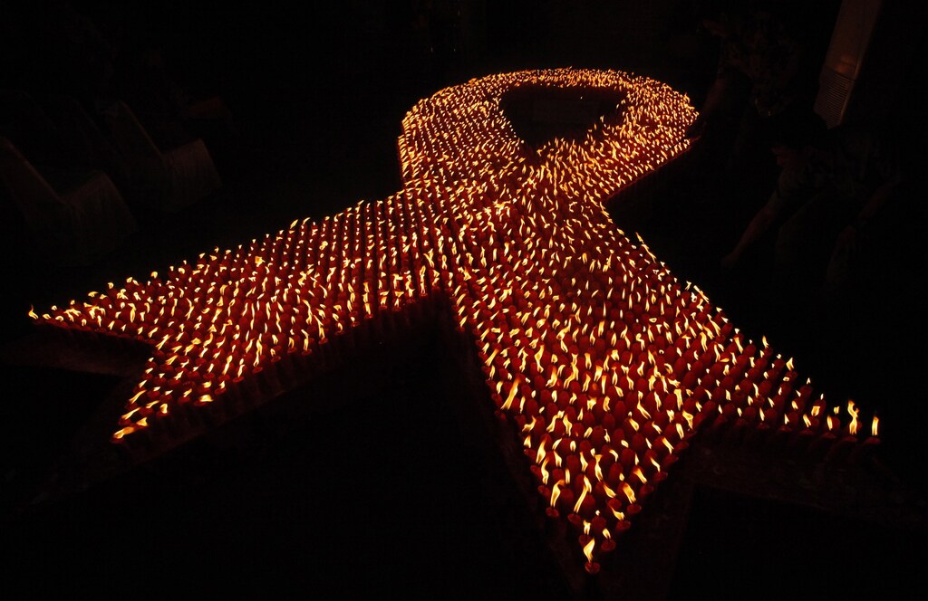 About 2880 candles are seen lit during a World AIDS Day event in Jakarta December 1, 2009. Fifty million women in Asia are at risk of being infected with HIV because of the risky sexual behaviour of their husbands or boyfriends, a report released by UNAIDS said in August. REUTERS/Dadang Tri (INDONESIA HEALTH ANNIVERSARY) - GM1E5C11TOZ01