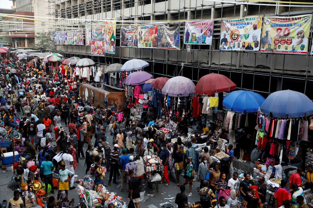 People crowd a market place as they shop in preparation for Christmas in Lagos, Nigeria.