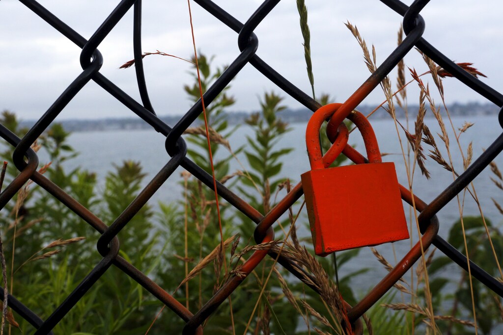 A lock hangs on a fence along the Cliff Walk in Newport, Rhode Island July 14, 2015.