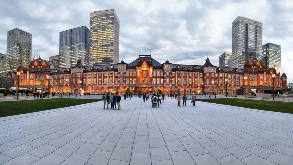A group of people standing in front of Tokyo station inn Japan: Japan and the Middle East seek to strengthen economic and diplomatic ties.
