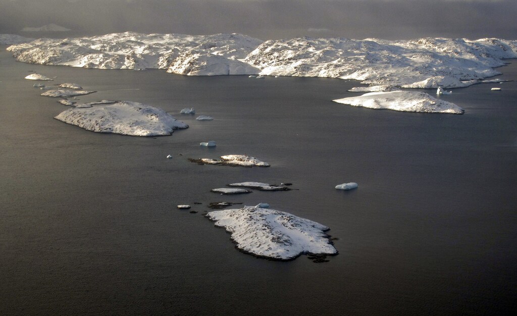 The snow-covered landscape is seen in an aerial photo near the town of Uummannaq in western Greenland March 17, 2010. Dutch artist Ap Verheggen plans to erect two giant sculptures on a piece of Greenland's sea ice and monitor them drifting away after the glacier breaks off. REUTERS/Svebor Kranjc (GREENLAND - Tags: ENVIRONMENT ENTERTAINMENT) - GM1E63I09X801