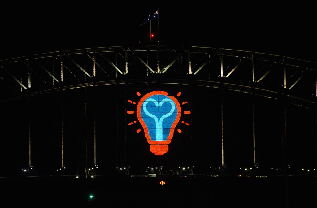 A light bulb motif made from LED lights is pictured on the side of the Sydney Harbour Bridge following the annual fireworks display to usher in the new year, early January 1, 2015. More than 10,000 aerial fireworks, 25,000 shooting comets and 100,000 pyrotechnic effects were used during the annual Sydney Harbour New Year's Eve show, with an estimated 1.6 million people watching from along the harbour foreshore, local media reported. REUTERS/Jason Reed (AUSTRALIA - Tags: SOCIETY ANNIVERSARY)