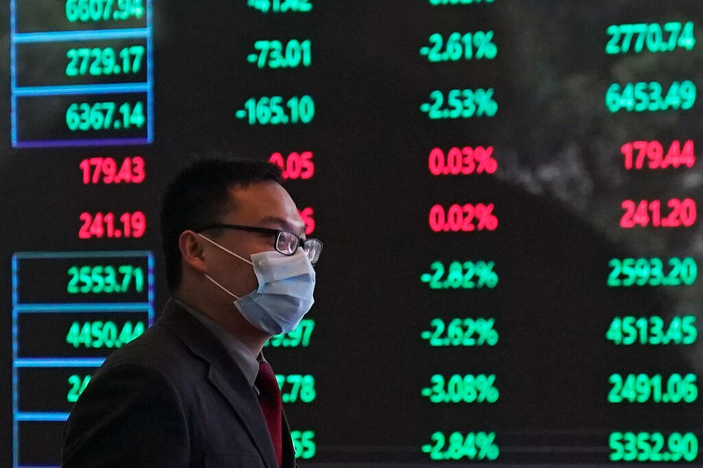 A man wearing a protective mask is seen inside the Shanghai Stock Exchange building, as the country is hit by a new coronavirus outbreak, at the Pudong financial district in Shanghai, China February 28, 2020.