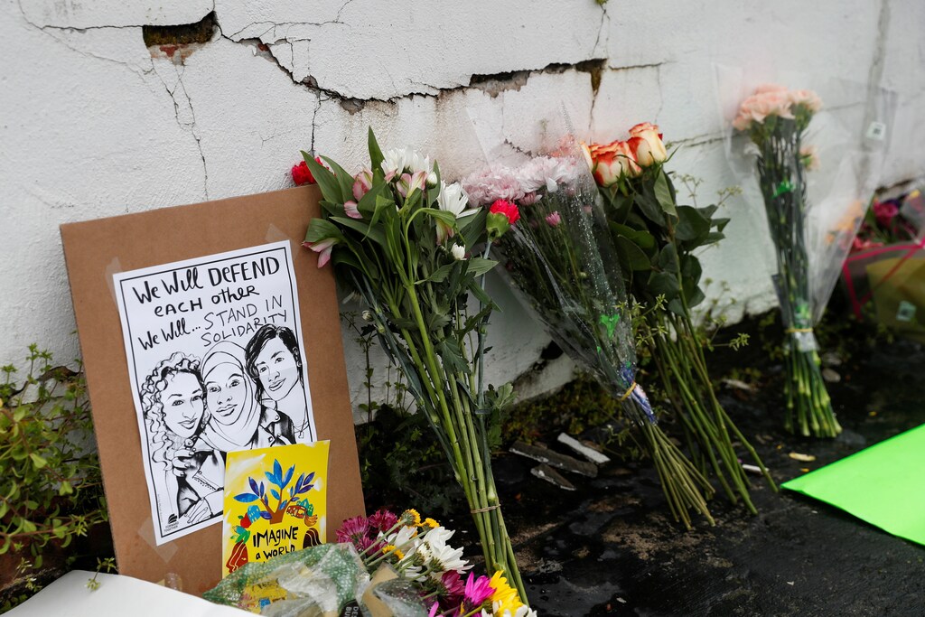 Flowers and a poster are left outside Gold Spa following the deadly shootings in Atlanta, Georgia, U.S. March 17, 2021. REUTERS/Shannon Stapleton REFILE - CORRECTING LOCATION? - RC29DM9RL0WD