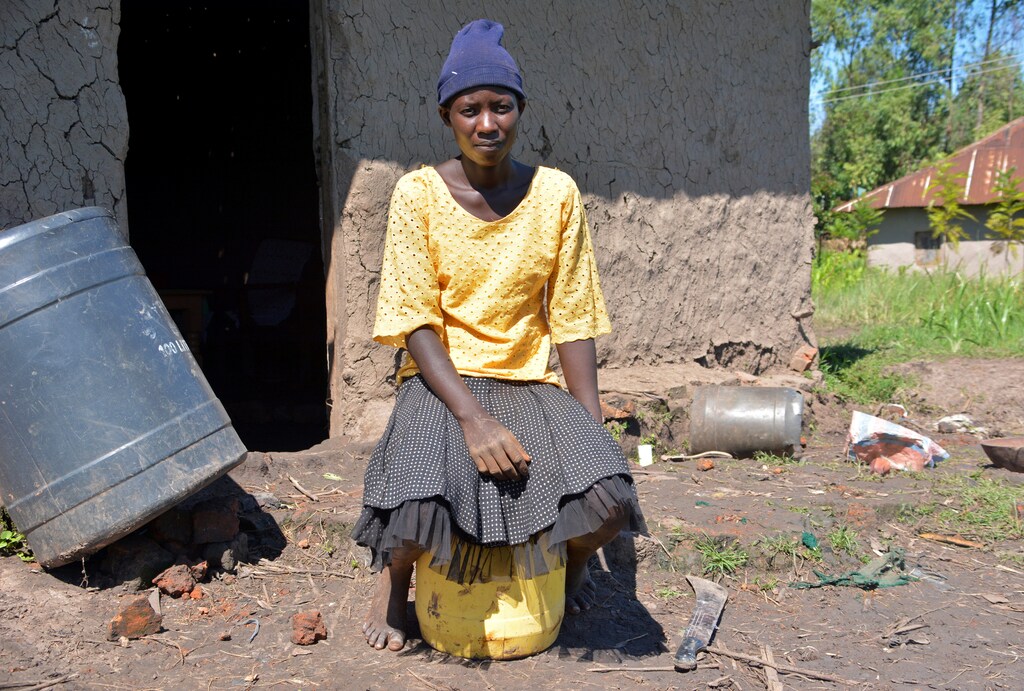 Diana Aluoch who lost her child due to malaria sits outside her house in Kamgan village of Nyakach, Kenya May 12, 2020. Picture taken May 12, 2020. REUTERS/Edwin Waita - RC22RG9RJHYQ