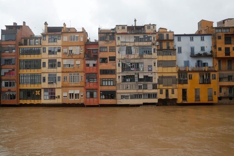 Houses are seen on the Onyar river during the storm "Gloria" in Girona, Spain, January 22, 2020. REUTERS/Nacho Doce -