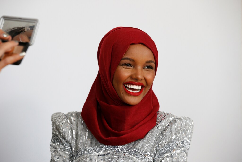 Fashion model and former refugee Halima Aden, who is breaking boundaries as the first hijab wearing model gracing magazine covers and walking in high profile runway shows has her makeup applied during a shoot at a studio in New York City, U.S .August 28, 2017. Photo taken August 28, 2017. REUTERS/Brendan McDermid - RC11EA18CF80