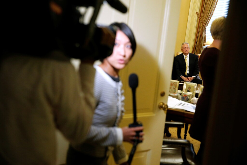 Video journalists enter the room to observe retired U.S. Marine Corps General James Mattis (seated), President-elect Donald Trump's nominee to be Defense Secretary, meeting with Senate Majority Leader Mitch McConnell (R-KY (not pictured) in McConnell's office at the Capitol in Washington, U.S. December 7, 2016. REUTERS/Jonathan Ernst - RC1AFA1C4100