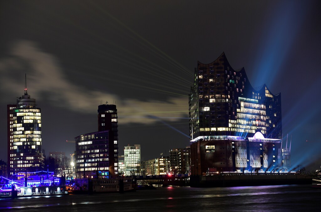 The "Elbphilharmonie" (Philharmonic Hall), which will open its doors to public on January 11, 2017, is illuminated during a light test in downtown Hamburg, Germany, January 9, 2017. REUTERS/Fabian Bimmer - RTX2Y6Y5