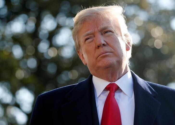 U.S. President Donald Trump speaks with the news media before boarding Marine One helicopter to depart for travel to California via Joint Base Andrews from the South Lawn of the White House in Washington, U.S., March 13, 2018. REUTERS/Leah Millis
