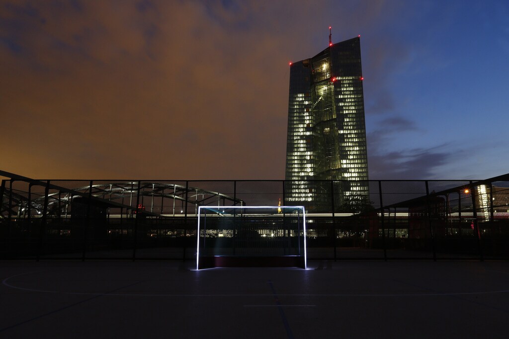 A photograph taken using long exposure shows a goalpost which has been illuminated with torches at a leisure facility in front of the European Central Bank (ECB) headquarters in Frankfurt June 1, 2014. The 2014 Brazil World Cup opens on June 12 and fans around the globe are gearing up for the big tournament. But soccer lovers are not only preparing to watch the world's best professional players battle it out on the pitch; they are also out there kicking a ball about themselves. Reuters photographers on every continent, in countries from China to the Czech Republic, went out to capture images of soccer goalposts used by players to practise the 'beautiful game'. Picture taken June 1, 2014. REUTERS/Ralph Orlowski (GERMANY - Tags: SPORT SOCCER WORLD CUP SOCIETY)ATTENTION EDITORS: PICTURE 24 OF 60 FOR PACKAGE '2014 WORLD CUP - AROUND THE WORLD IN 60 GOALS'TO FIND ALL IMAGES SEARCH 'GLOBAL GOALPOSTS' - GM1EA690J9J01