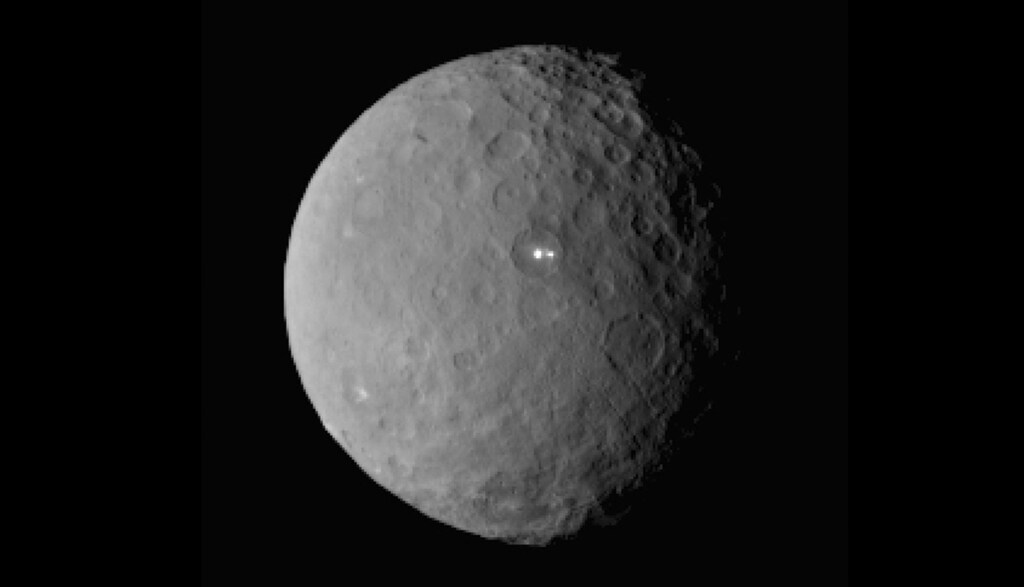 The dwarf planet Ceres taken by NASA's Dawn spacecraft on February 19, 2015 from a distance of nearly 29,000 miles is shown in this handout photo provided by NASA March 2, 2015. It shows that the brightest spot on Ceres has a dimmer companion, which apparently lies in the same basin according to NASA.