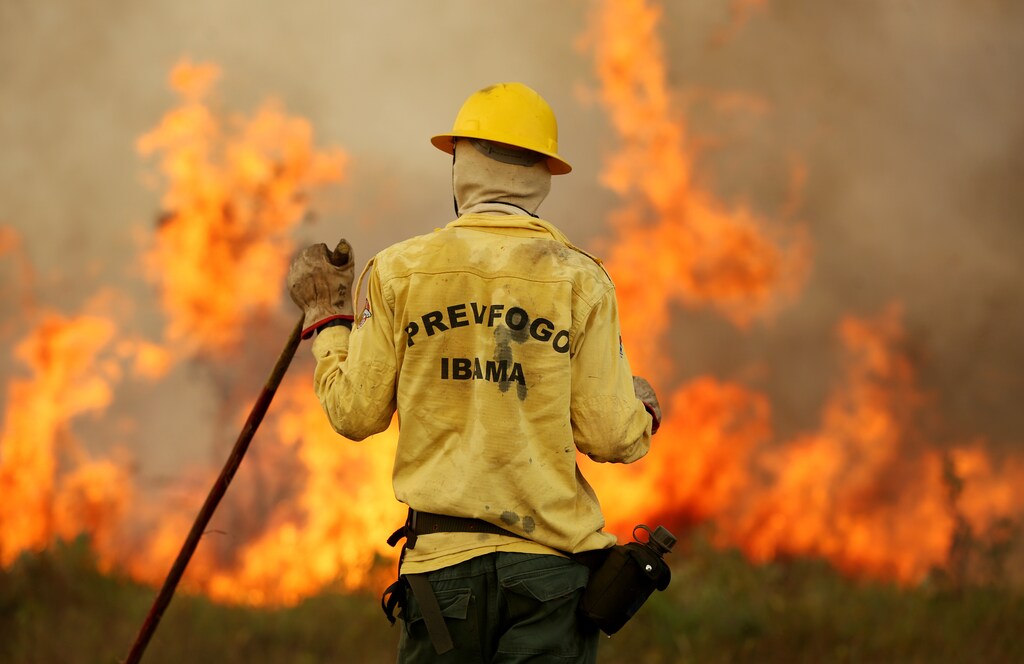 A Brazilian Institute for the Environment and Renewable Natural Resources (IBAMA) fire brigade member is seen as he attempts to control hot points during a fire at Tenharim Marmelos Indigenous Land, Amazonas state, Brazil, September 15, 2019. Picture taken September 15, 2019. REUTERS/Bruno Kelly - RC1683941F20