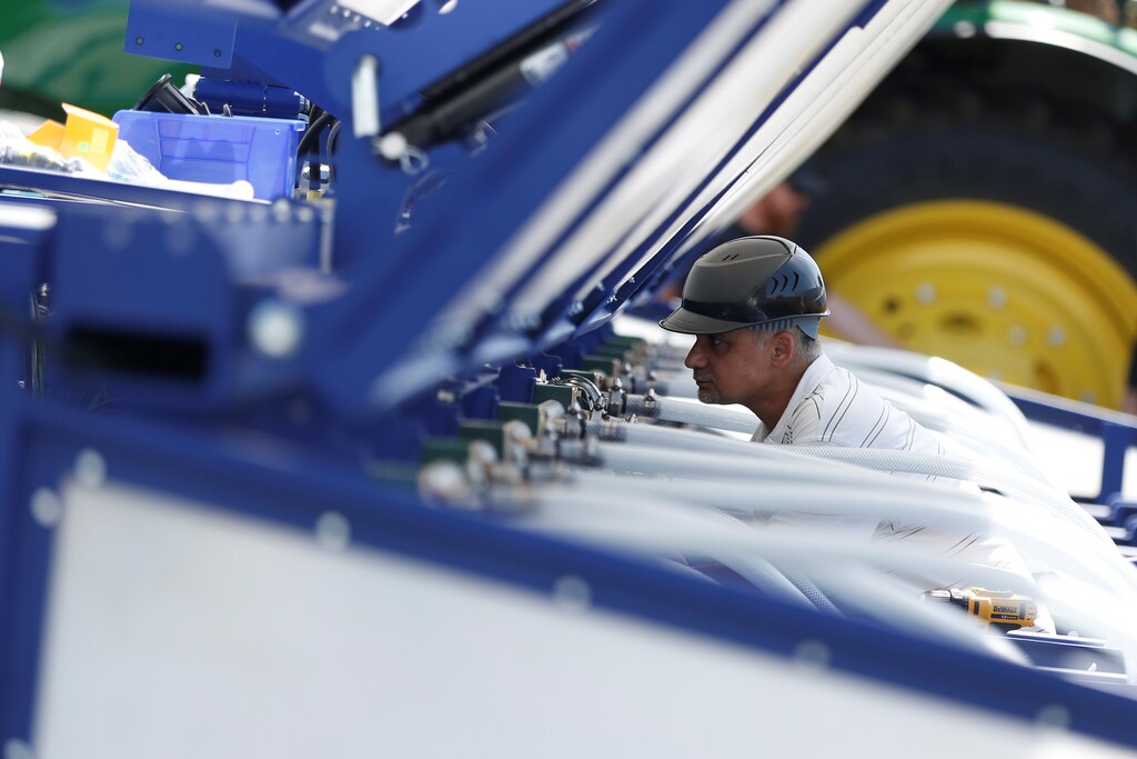 An engineer assembles a Blue River Technology See & Spray agricultural machine that combines computer vision and artificial intelligence to detect and precisely spray herbicides onto weeds in a farm field in Sunnyvale, California, April 23, 2018. Picture taken April 23, 2018. REUTERS/ Stephen Lam - RC1937E08870
