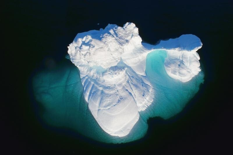 An iceberg floats in a fjord near the town of Tasiilaq, Greenland, June 18, 2018. REUTERS/Lucas Jackson SEARCH "JACKSON GREENLAND" FOR THIS STORY. SEARCH "WIDER IMAGE" FOR ALL STORIES. - RC1C21D19160
