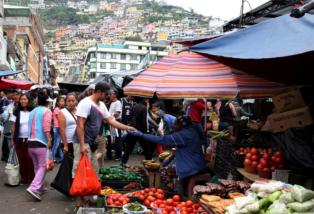 Woman sells vegetables at San Roque market in Quito, Ecuador, February 18, 2017.