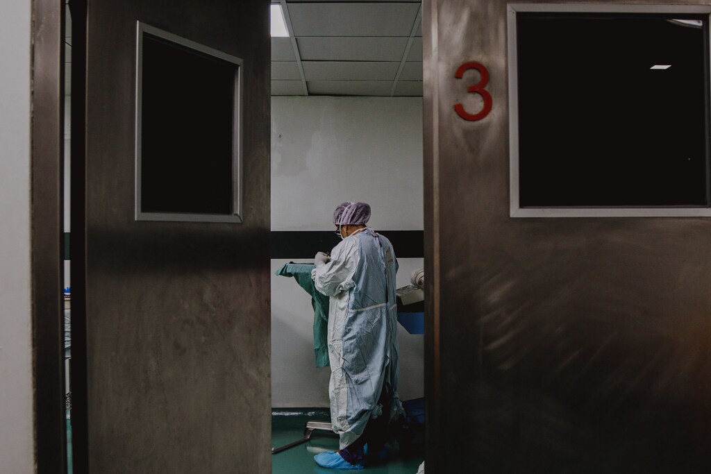 A person in medical scrubs.