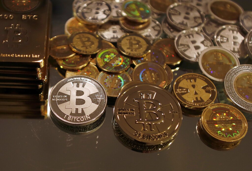 Bitcoins created by enthusiast Mike Caldwell are seen in a photo illustration at his office in Sandy, Utah, September 17, 2013.